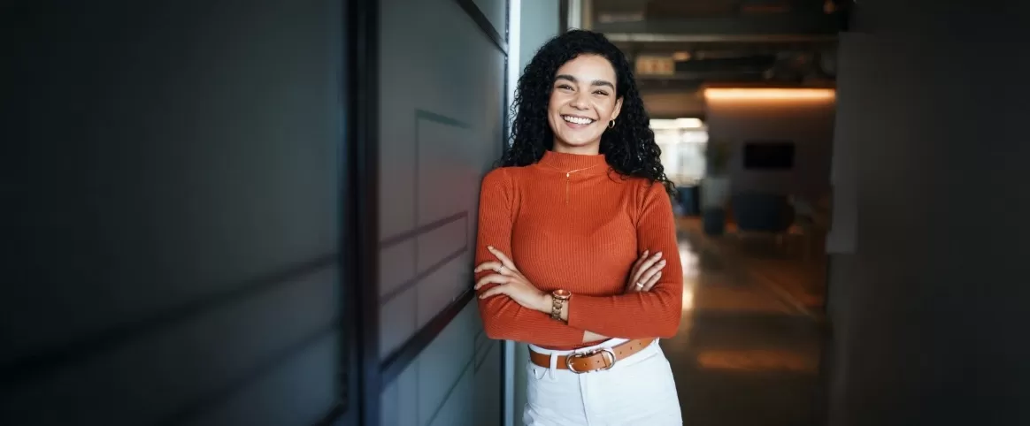 Woman leaning against a wall